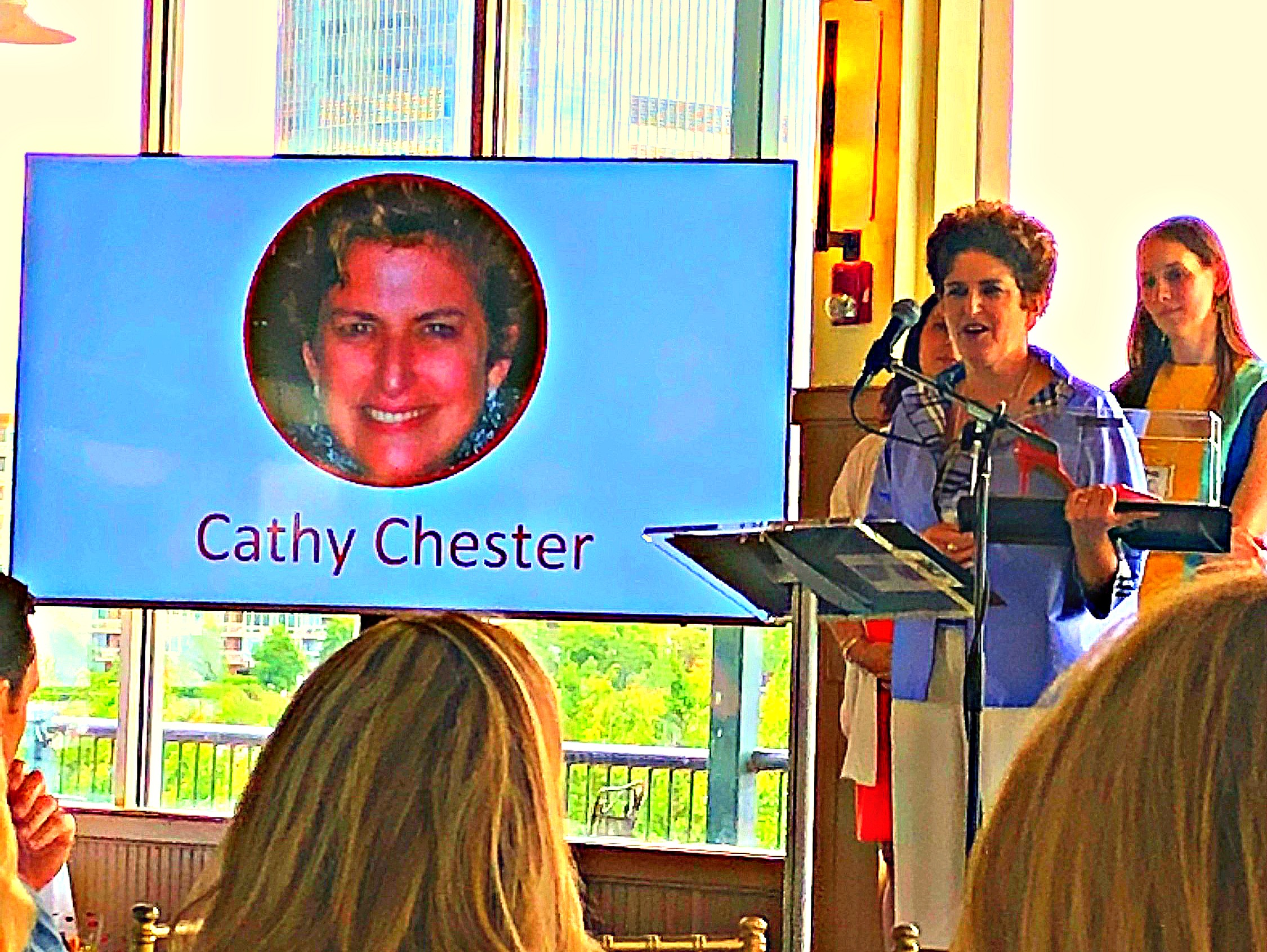 woman at podium giving acceptance speech